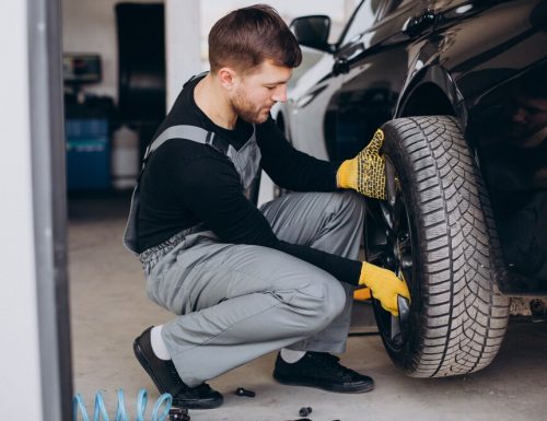 car-mechanic-changing-wheels-car_1303-27471.jpg